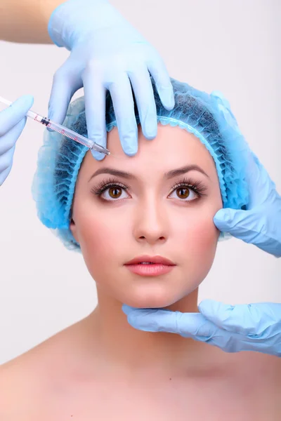 Young woman receiving plastic surgery injection on her face close up — Stock Photo, Image