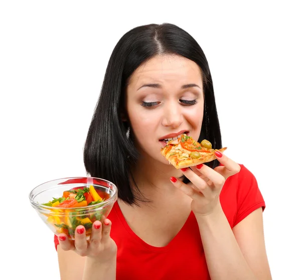 Vacker flicka äter pizza isolerad på vit Stockbild