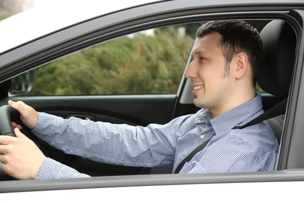 Portrait of young man sitting in the car — Stock Photo, Image