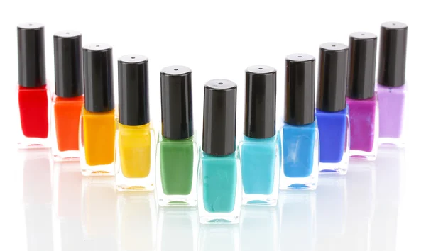 Grupo de esmaltes de uñas brillantes aislados en blanco — Foto de Stock