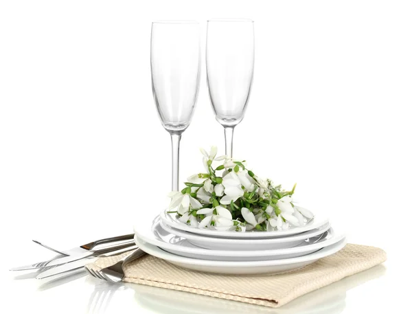 Serving dishes and snowdrops isolated on white — Stock Photo, Image