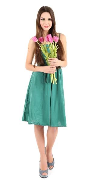 Young beautiful girl in green dress with tulips in her hand, isolated on white — Stock Photo, Image