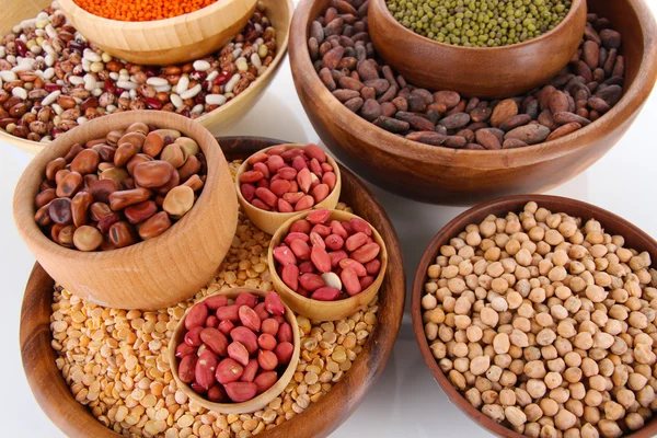 Different kinds of beans in bowls close-up — Stock Photo, Image