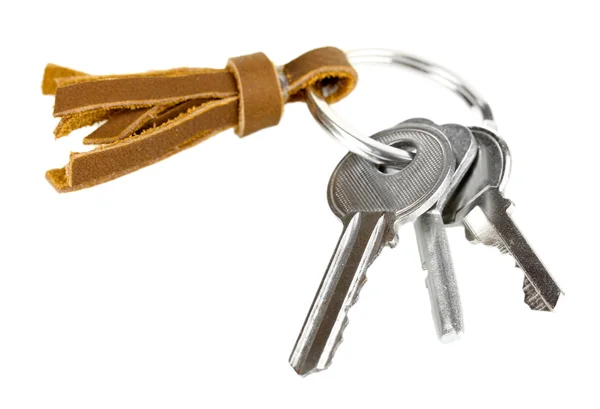 Key with leather trinket isolated on white — Stock Photo, Image