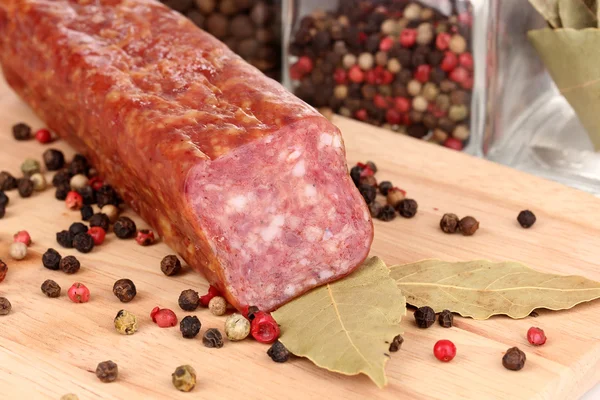 Tasty sausage on chopping board close-up — Stock Photo, Image