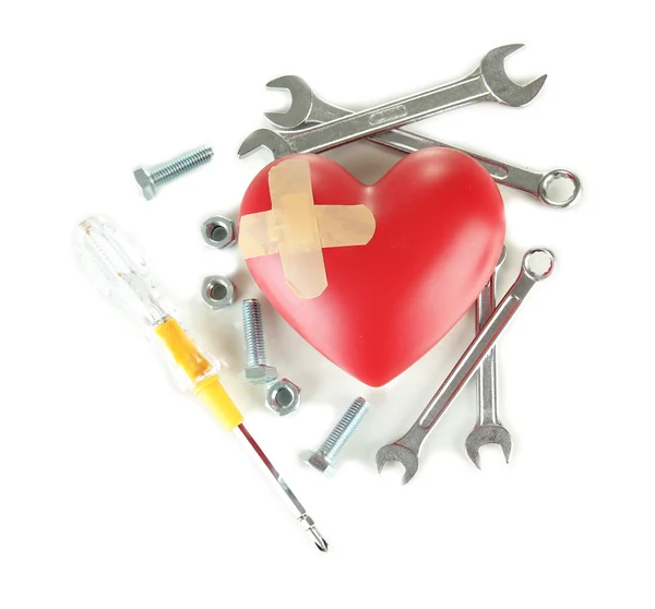 Heart and tools. Concept: Renovation of heart. Isolated on white — Stock Photo, Image