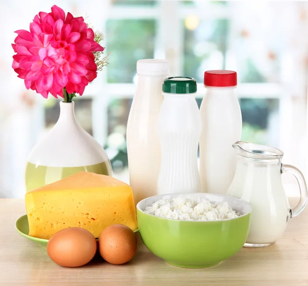 Dairy products and eggs on table in kitchen — Stock Photo, Image