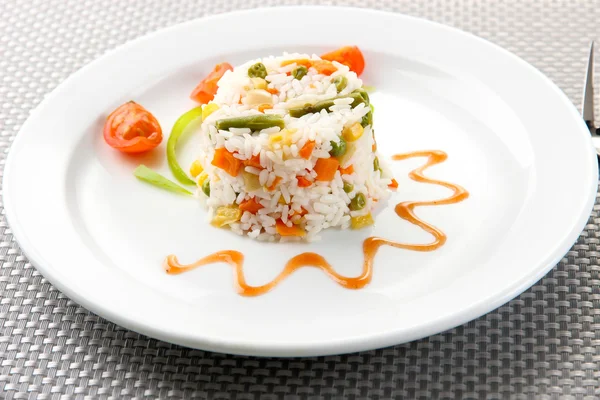Delicious risotto with vegetables on table — Stock Photo, Image