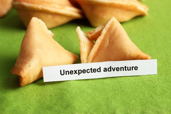 Fortune cookies on green tablecloth — Stock Photo, Image