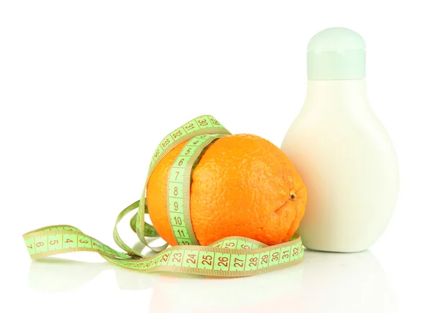 Orange with measuring tape and body cream, isolated on white — Stock Photo, Image