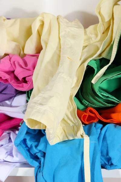 Clothing scattered on shelves — Stock Photo, Image