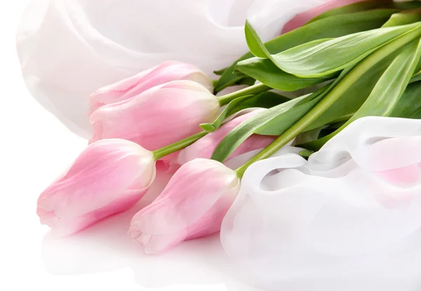 Beautiful bouquet of pink tulips on cloth, isolated on white — Stock Photo, Image