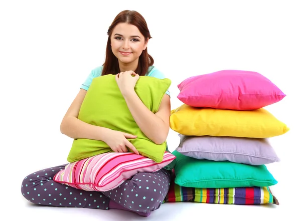 Beautiful young girl with pillows isolated on whit — Stock Photo, Image