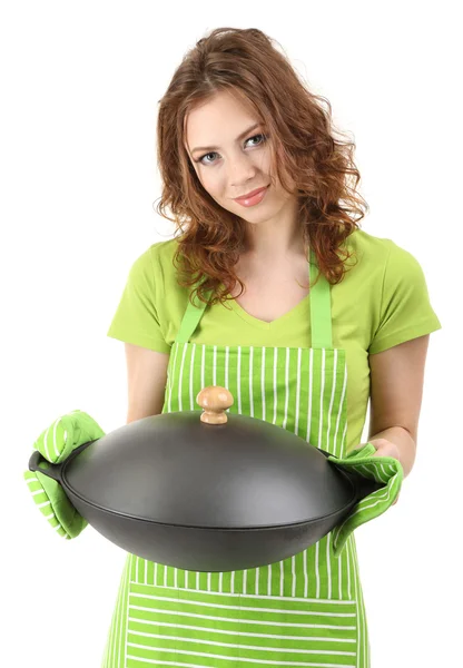 Young woman wearing kitchen apron with wok pan, isolated on white — Stock Photo, Image