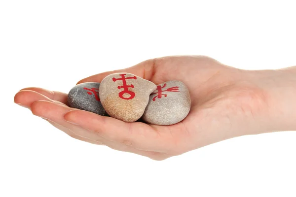 Fortune telling with symbols on stone in hand isolated on white — Stock Photo, Image