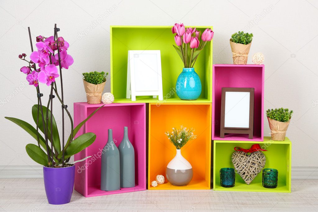 Beautiful colorful shelves with different home related objects