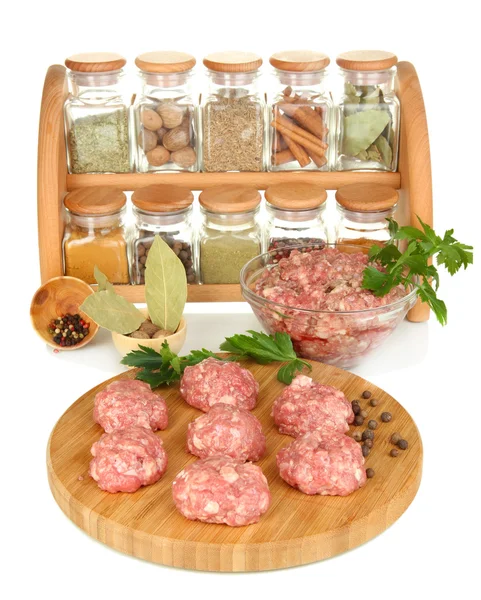 Raw meatballs with spices isolated on white — Stock Photo, Image