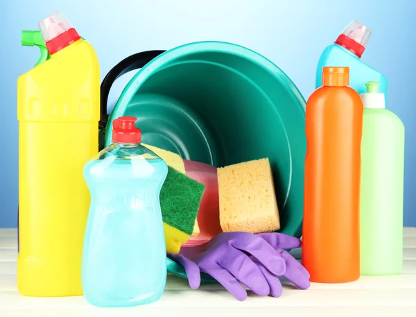 Cleaning items in bucket on color background — Stock Photo, Image