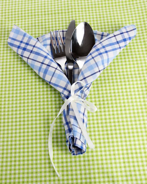 Fork,spoon,knife and napkin on bright background — Stock Photo, Image