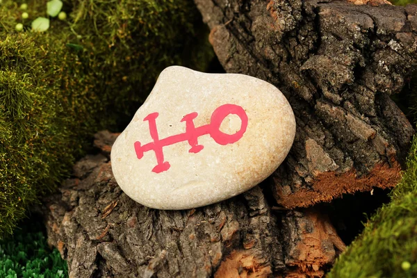 Fortune telling with symbols on stone close up — Stock Photo, Image