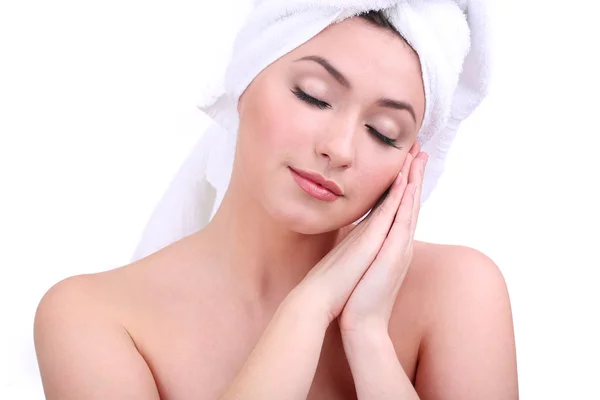 Beautiful young woman with towel on her head isolated on white — Stock Photo, Image