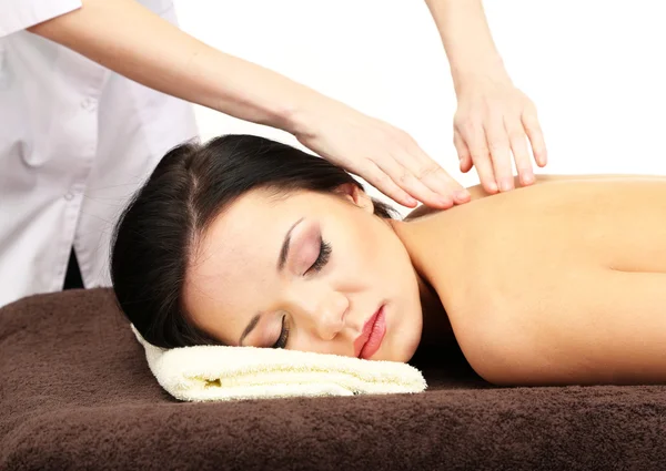 Vacker ung kvinna i spasalong får massage, isolerad på vit — Stockfoto