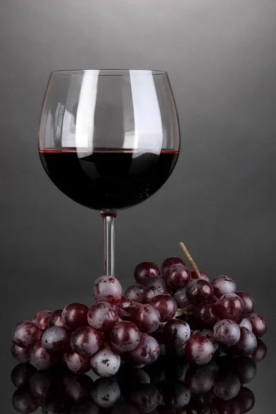 Red wine glass on grey background — Stock Photo, Image