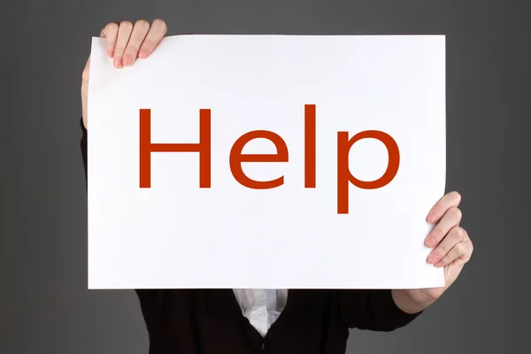 Woman holding paper with text in front of her face, on color background — Stock Photo, Image