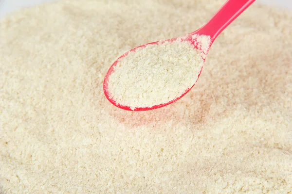 Powdered milk with spoon for baby close-up — Stock Photo, Image