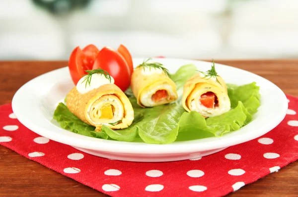 Egg rolls with cheese cream and paprika,on plate, on bright background — ストック写真