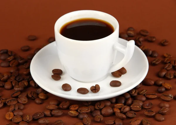 Cup of strong coffee on brown background — Stock Photo, Image