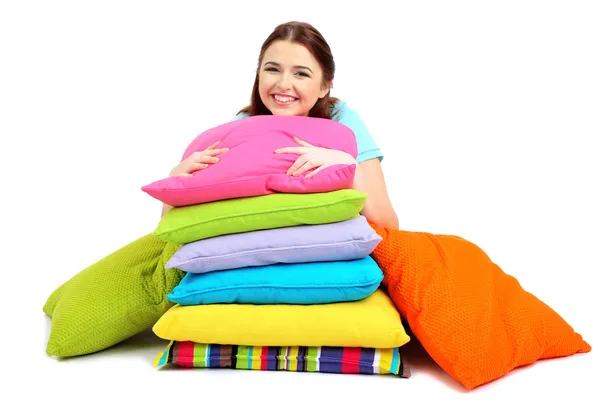 Beautiful young girl with pillows isolated on whit — Stock Photo, Image