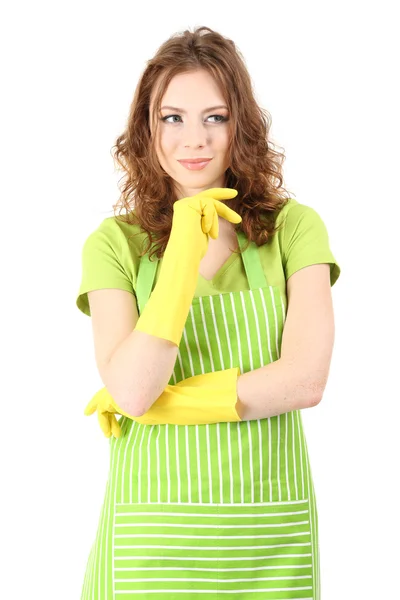 Mujer joven con delantal verde y guantes de goma, aislada en blanco — Foto de Stock