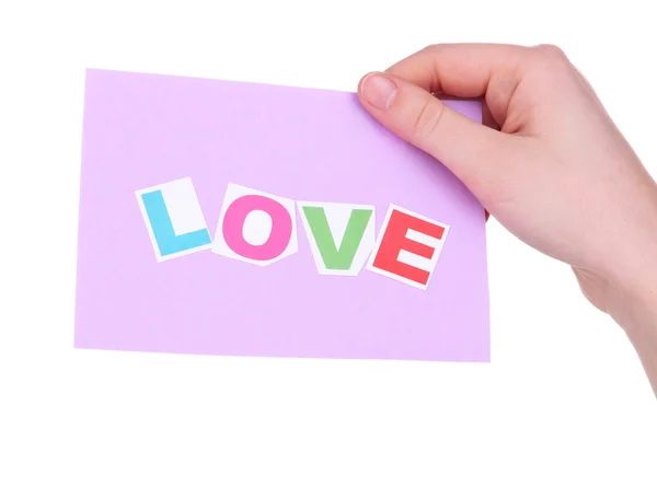Λέξη αγάπη σε κομμάτι χαρτί στο χέρι που απομονώνονται σε λευκό — Φωτογραφία Αρχείου