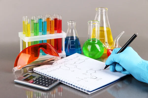 Hand scientist writing formulas — Stock Photo, Image