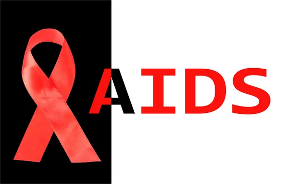 Aids awareness red ribbon isolated on black with aids word — Stock Photo, Image