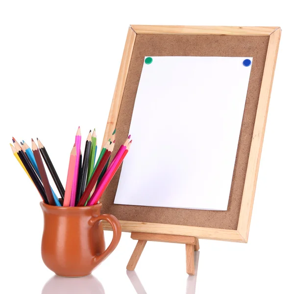 Small easel with sheet of paper with art supplies isolated on white — Stock Photo, Image