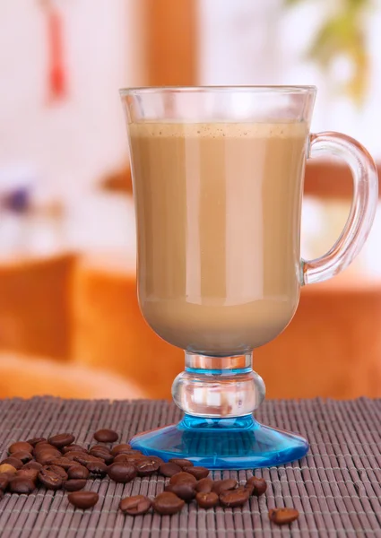 Layered coffee in glass on table on bright background — Zdjęcie stockowe