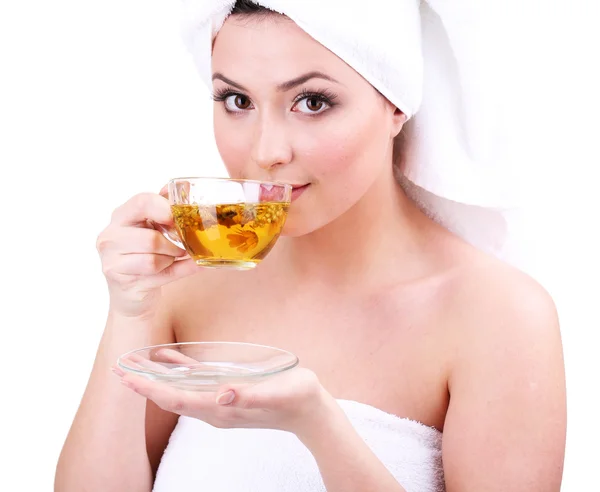 Beautiful young woman with cup of herbal tea isolated on white — Stock Photo, Image