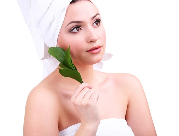 Beautiful young woman with green leafs isolated on white — Stock Photo, Image