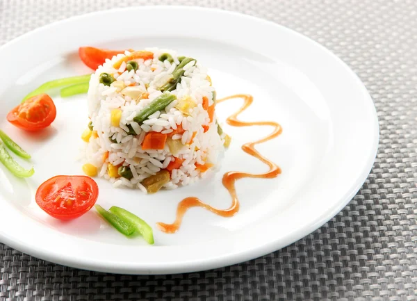Delicious risotto with vegetables on table — Stock Photo, Image