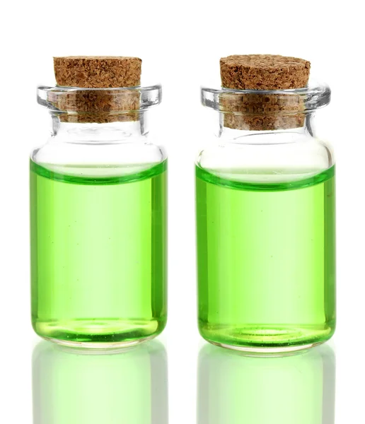 Пляшки з основними оліями ізольовані на білому — стокове фото