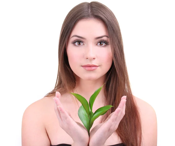 Krásná mladá žena s green leafs izolovaných na bílém — Stock fotografie
