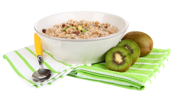 Harina de avena útil en tazón con fruta aislada en blanco —  Fotos de Stock