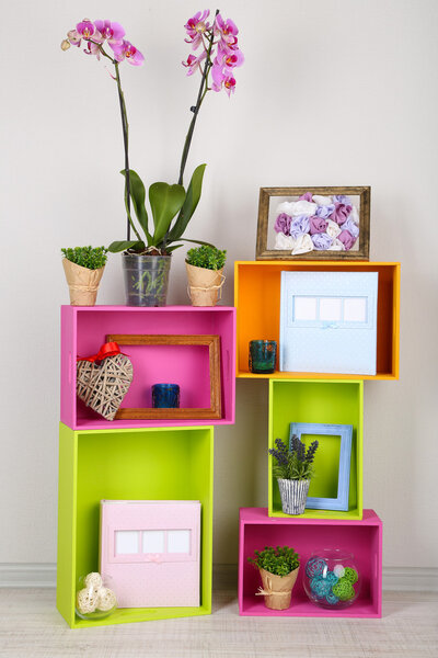 Beautiful colorful shelves with different home related objects