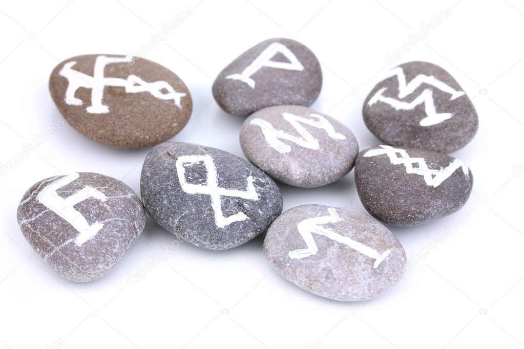 Fortune telling with symbols on stones isolated on white