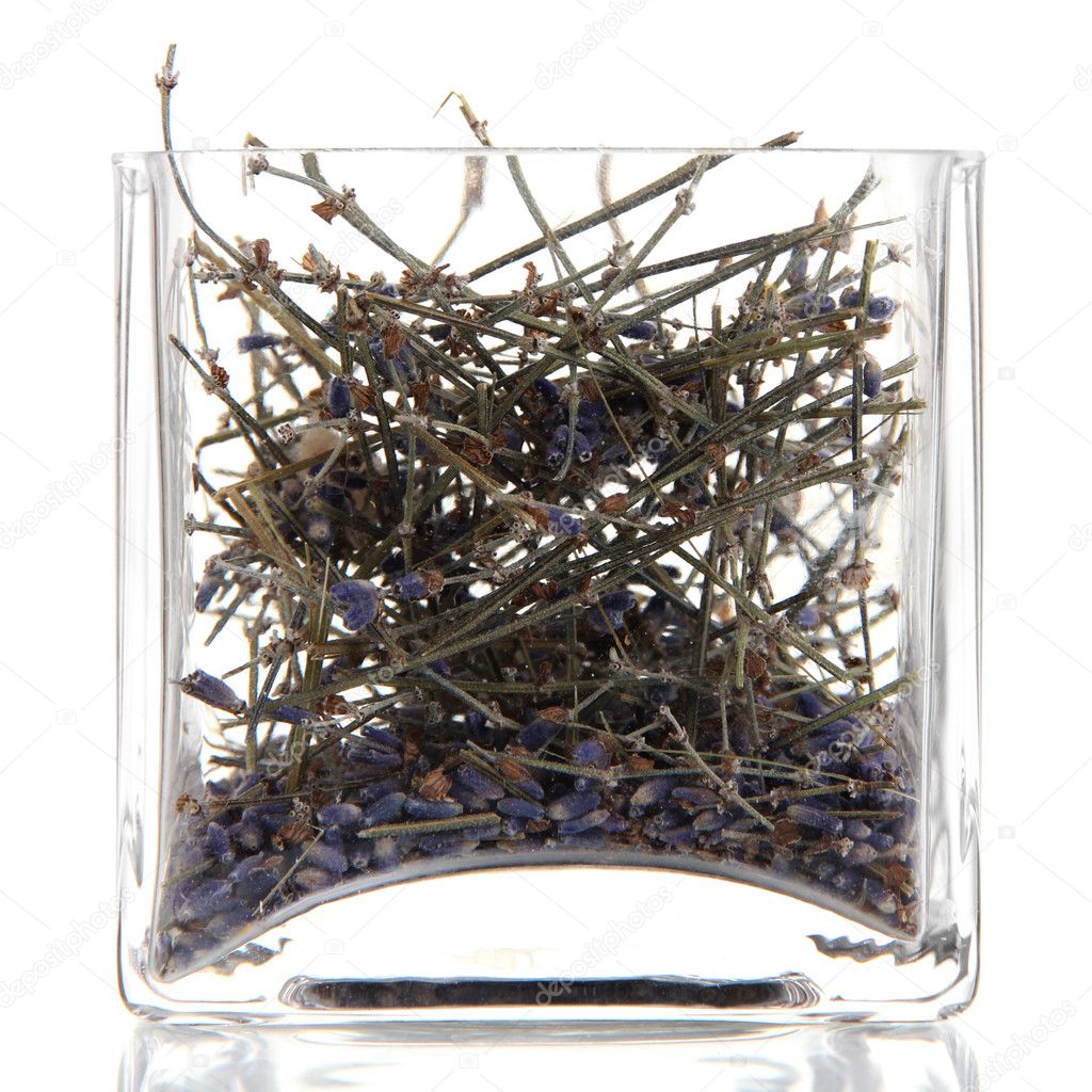 Dried herb in glass container isolated on white