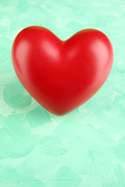 Decorative red heart on color background — Stock Photo, Image