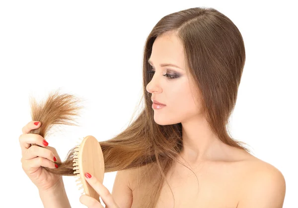 Beautiful woman holding split ends of her long hair, isolated on white — Stock Photo, Image