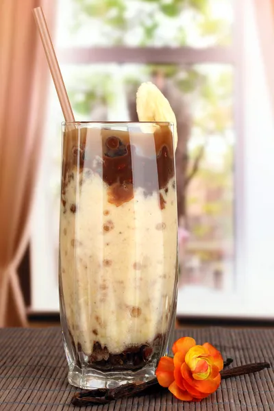 Delicious fruit smoothie on window background — Stock Photo, Image